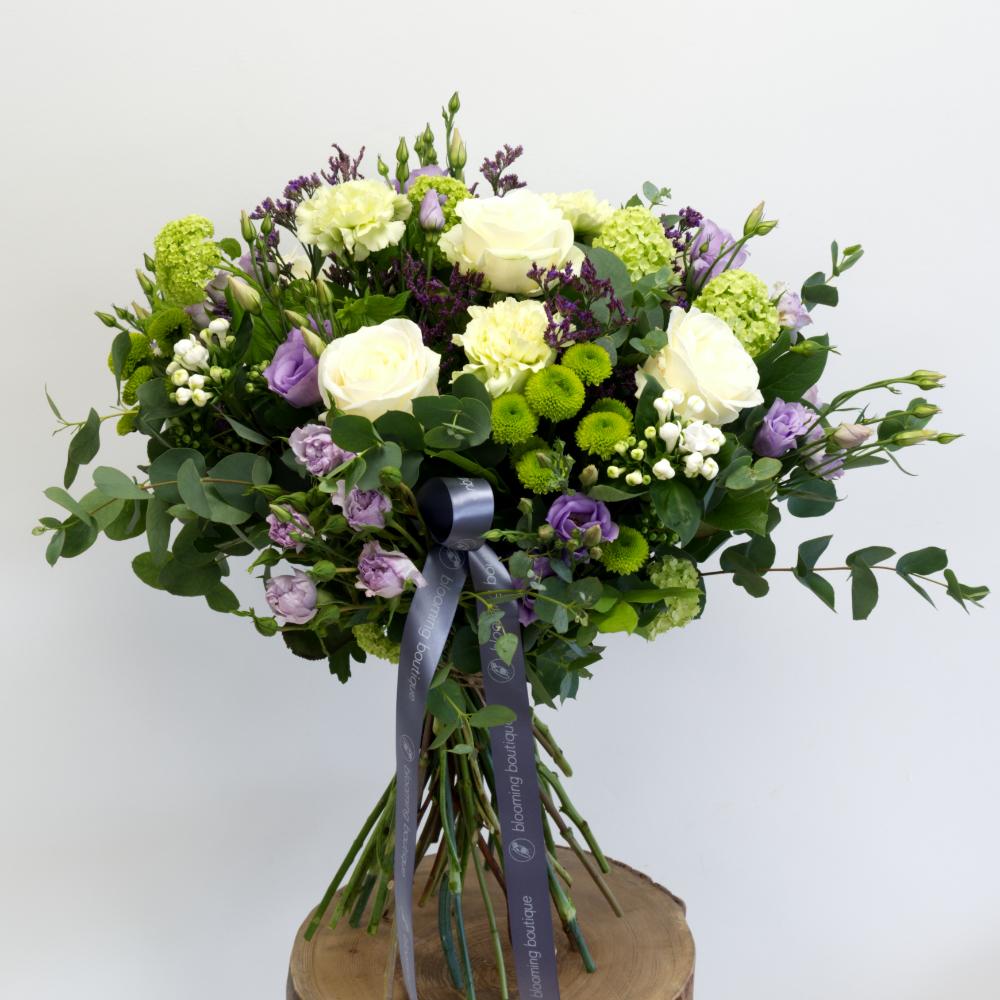 Large and spray roses combine with blue Eryngium, Viburnum, Bouvardia, and Lizianthus Flower Bouquet Same Day Flower Delivery Dublin or Next Day Flowers Delivery Ireland