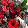 Christmas Wonder. Beautiful Christmas Flower Bouquet in red and platinum shades including Ilex berries, spray roses, gerberas, pine cones and Christmas foliage. We deliver flowers throughout Dublin and Ireland. Please place your order by 1 pm for Same Day Flower Delivery in Dublin or Next Day Flowers Delivery Ireland.