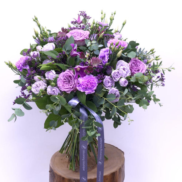 Day Dream Flower Bouquet. The stunning shades of light lilac balanced with deep rich shades of dark purple are a perfect combination for unforgettable memories. We deliver flowers throughout Dublin and Ireland. Please place your order by 1 pm for Same Day Flower Delivery in Dublin or Next Day Flowers Delivery Ireland and Raheny Free Delivery
