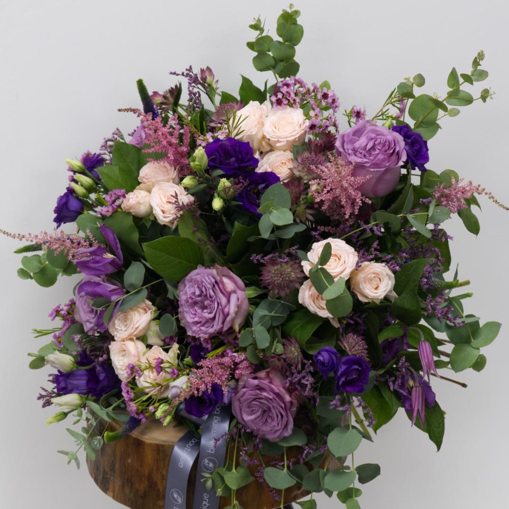 The Emma floral bouquet joins together a collection of luxury flowers, including amazing purple roses, Astilbe, Wax, Limonium, Lizianthus, and Astrantia to enchant any space. Please place your order by 1 pm for Same Day Flower Delivery in Dublin or Next Day Flowers Delivery Ireland and also Raheny Free Delivery.