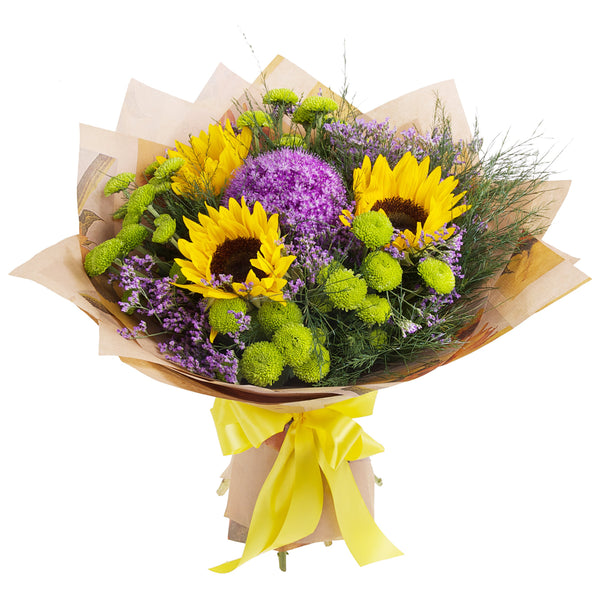 The mix of Sunflowers, Green Chrysanthemums, and purple blooms is a great way to send best wishes and remind someone special that you are thinking of them. Sunflowers might be replaced by yellow Gerberas